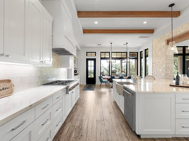 Kitchen with controlled recessed, under-cabinet, and pendant lighting