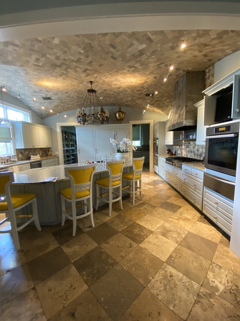 Kitchen with recessed and pendant lighting at the Balcones residence