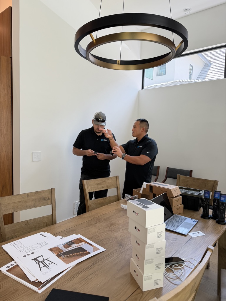 ATX Smart Homes team discussing plans inside a modern home