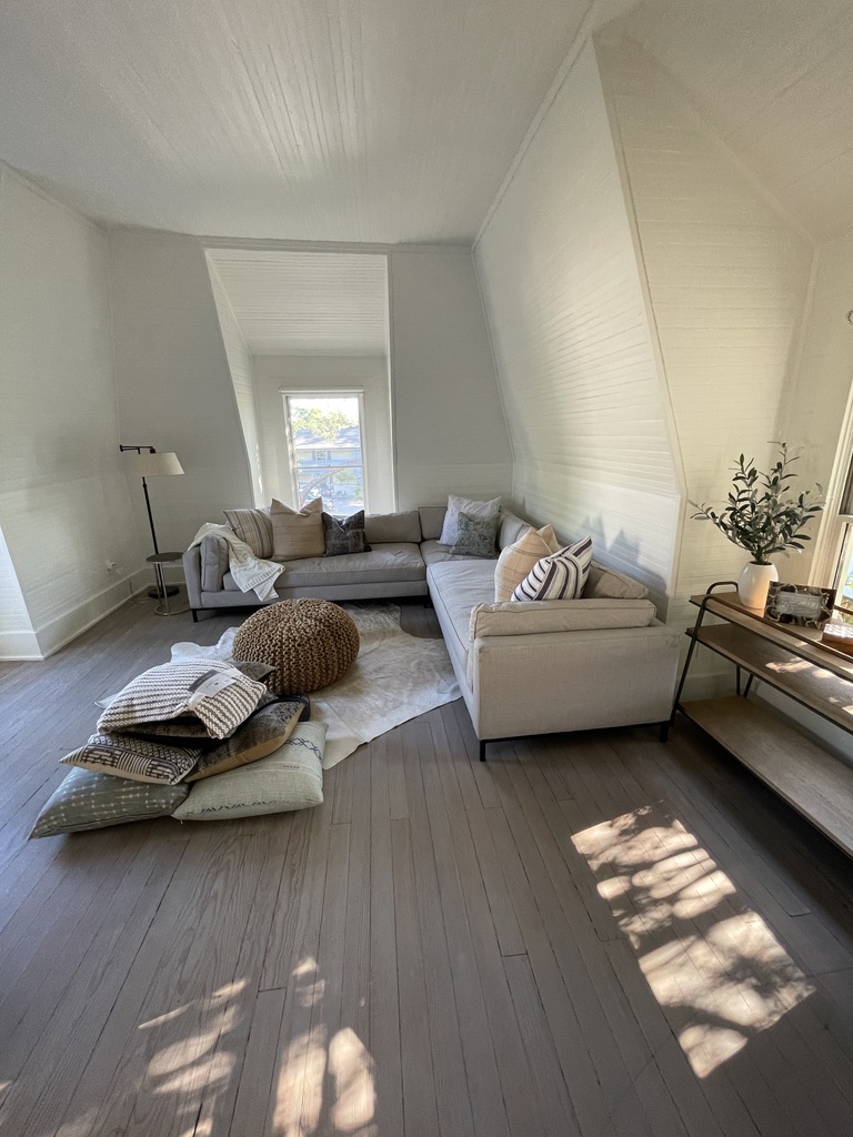 Sunlit sitting room with an integrated, understated interior
